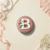 Bolacha de especiarias redonda, decorada à mão com glacê real